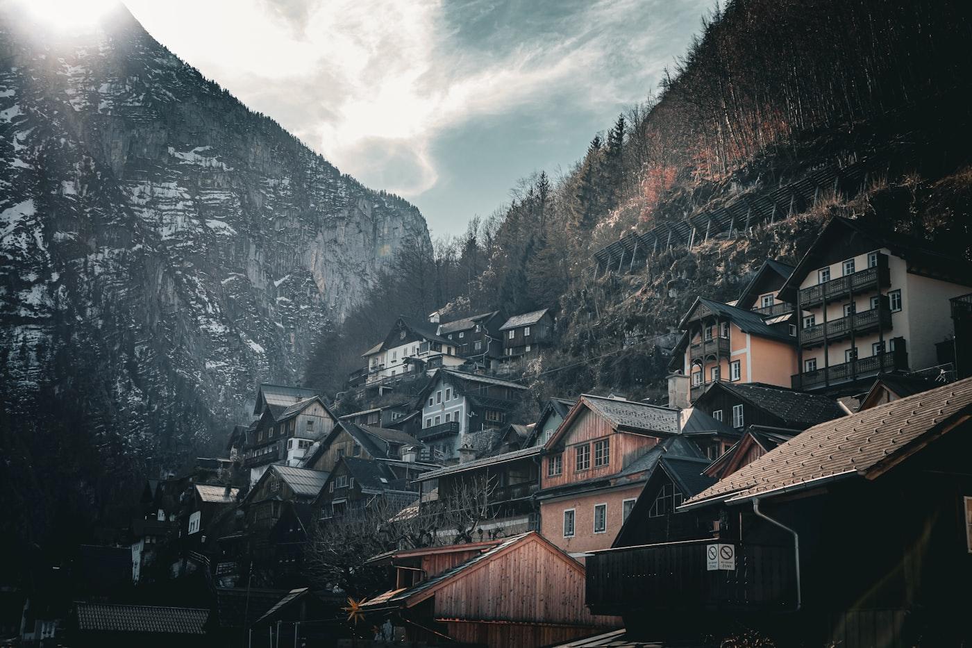 A mountain village with a mountain in the background