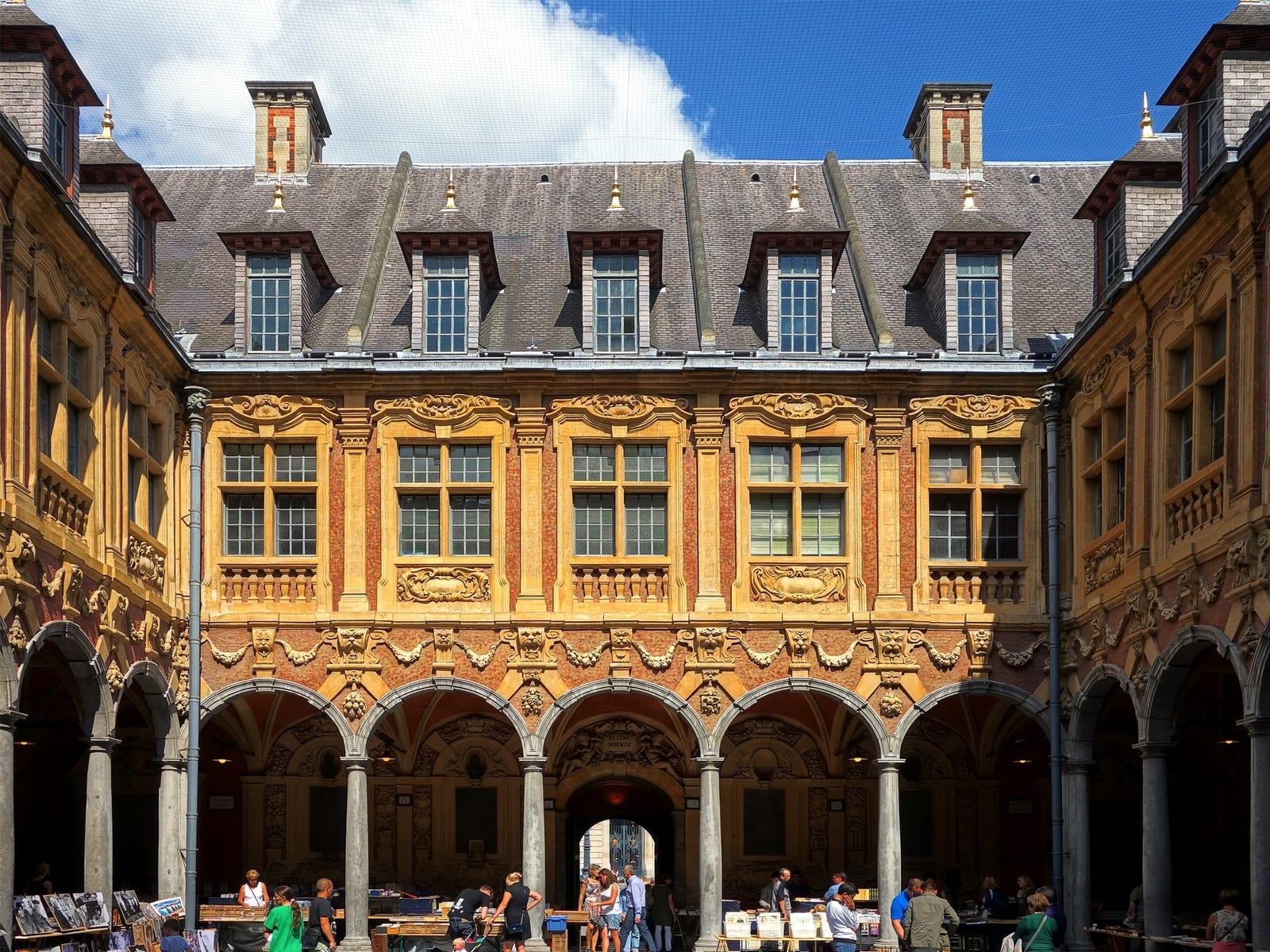 The inner courtyard of the Vieille Bourse, ringed by carved facades