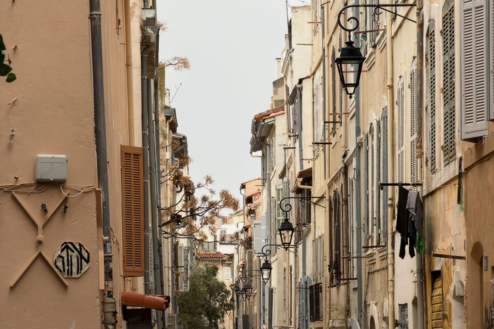 A narrow street of coloured facades in the Panier quarter