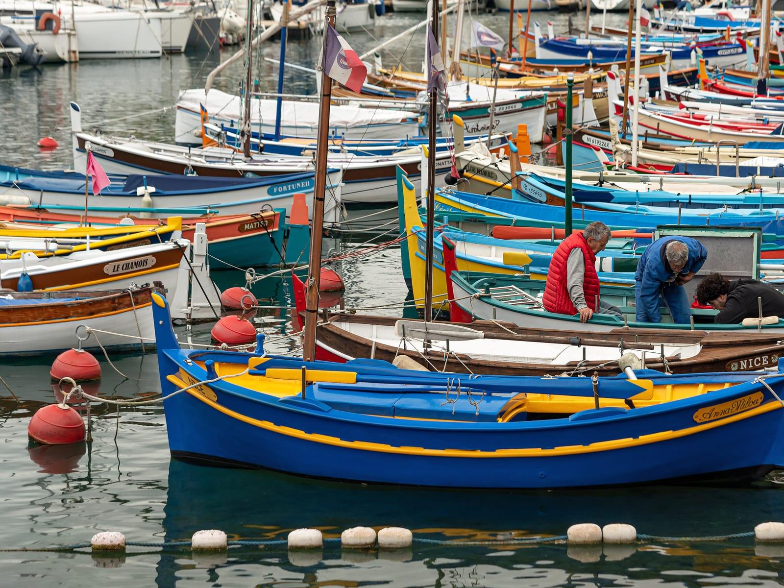 Painted fishing boats moored in the port of Nice